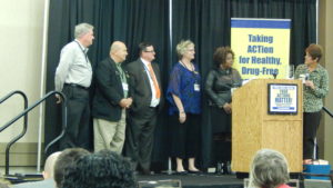 Diana Wilhold, Board President of ACT Missouri, and the Board of Directors presented the current staff with a plaque commemorating 25 Years.